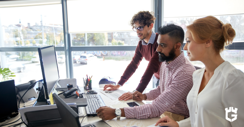 employees reviewing cyber coverage