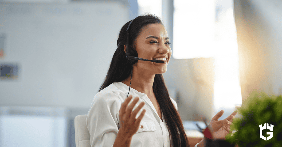 Smiling insurance representative on a headset providing customer support during the claims process