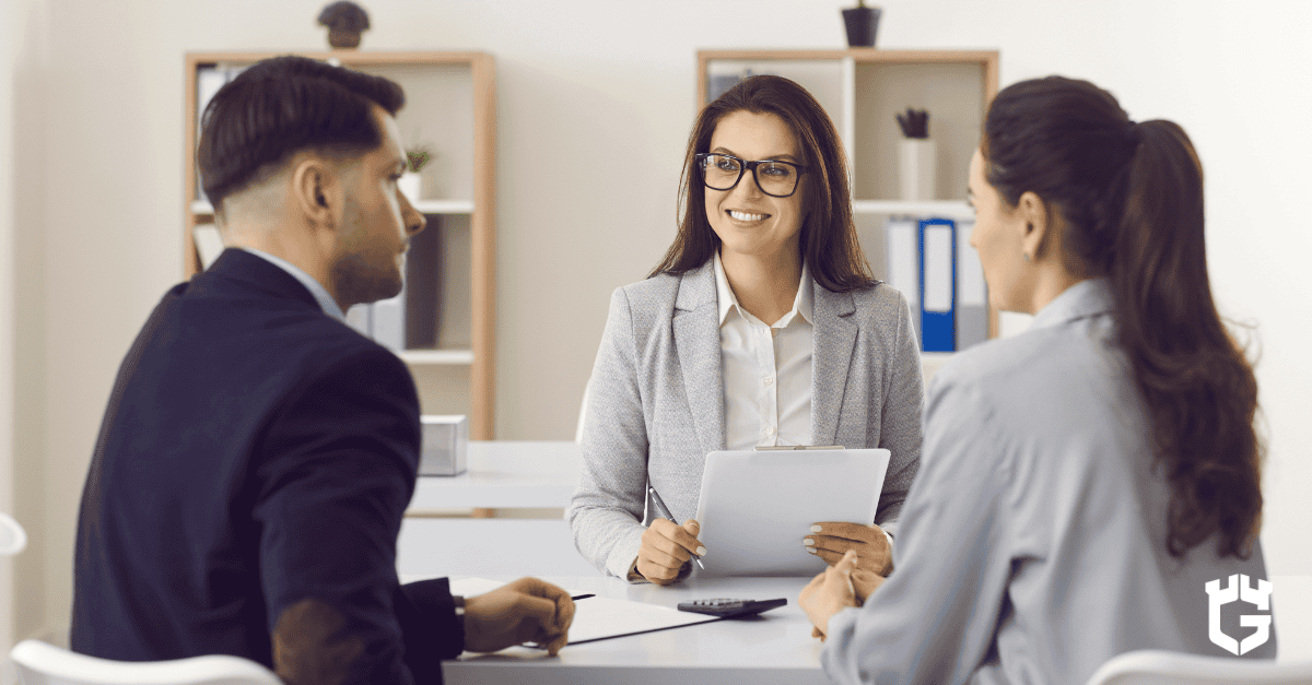 Insurance broker discussing coverage options with a couple
